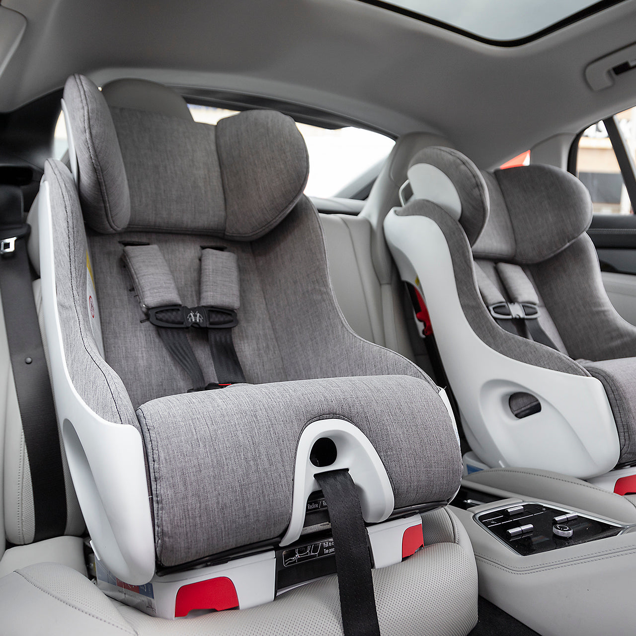 Clek Foonf convertible car seats installed forward-facing in a Porsche Panamera