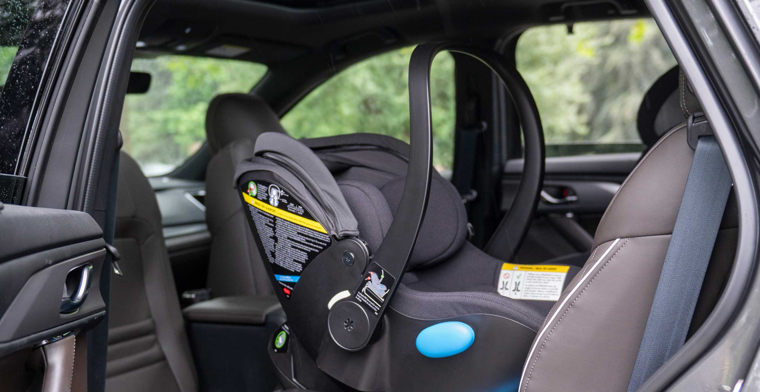 Clek Liing infant car seat in railroad flame-retardant free fabric installed in an SUV