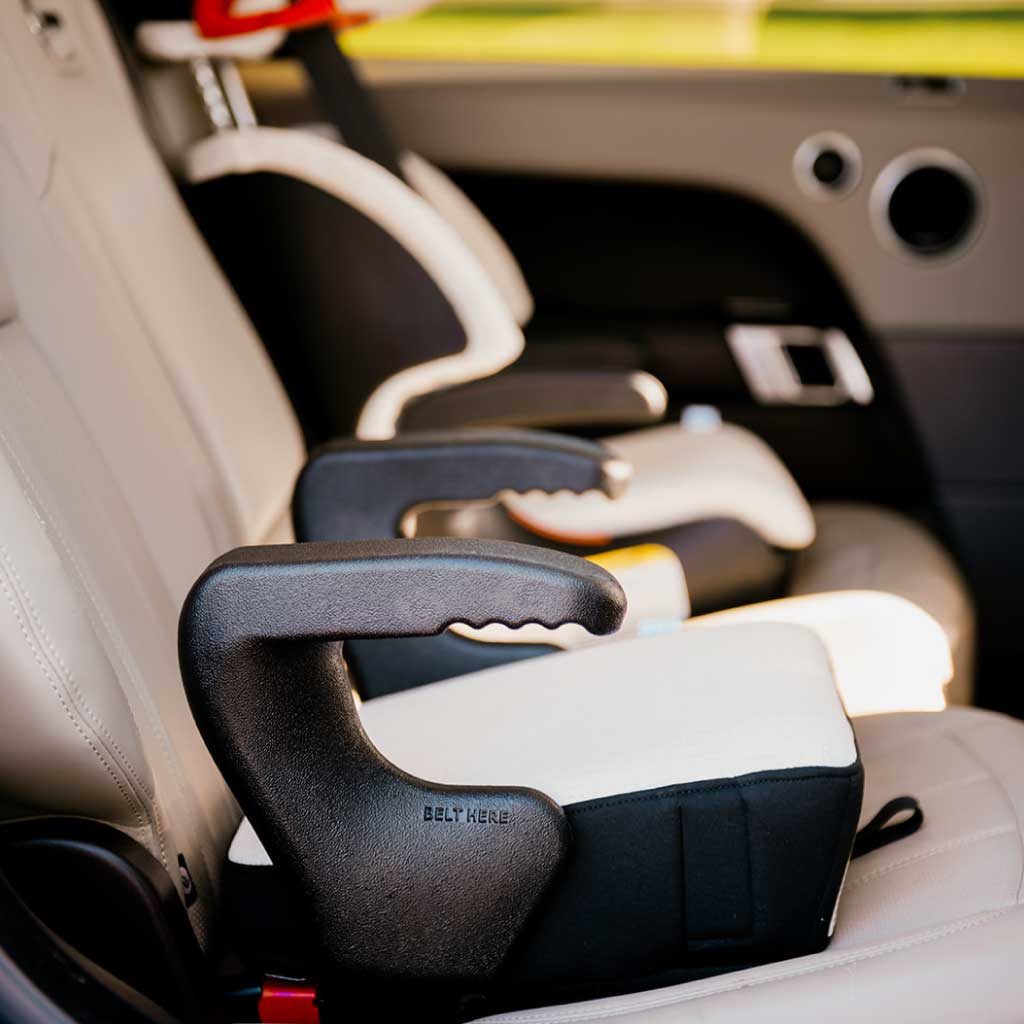 Clek booster seats installed in a Range Rover SUV