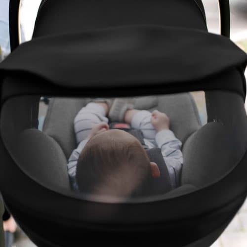 Closeup of the mesh window on a Clek Liingo infant car seat canopy