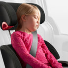 Child in a car seat with a pink sweater, inside a vehicle. all-groups