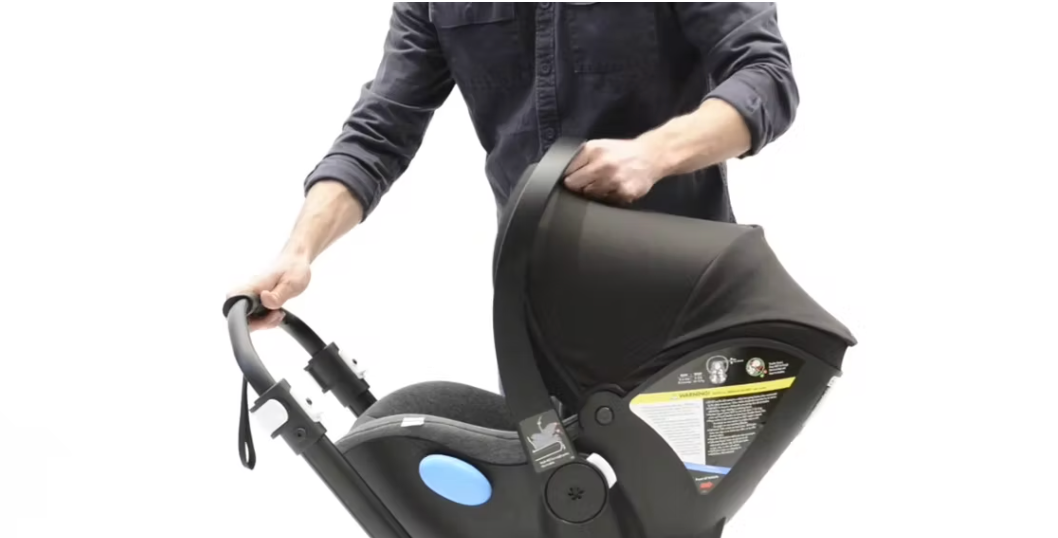 Clek founder Chris Lumley installing a Clek Liing infant car seat