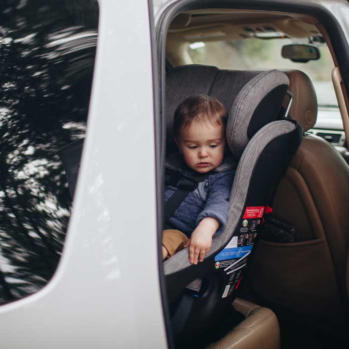 Clek Fllo Convertible Car Seat installed in rear-facing mode in an SUV
