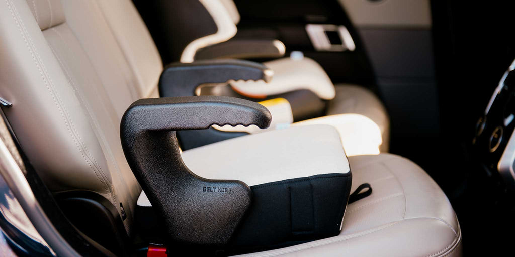 Clek booster seats installed in a Range Rover SUV