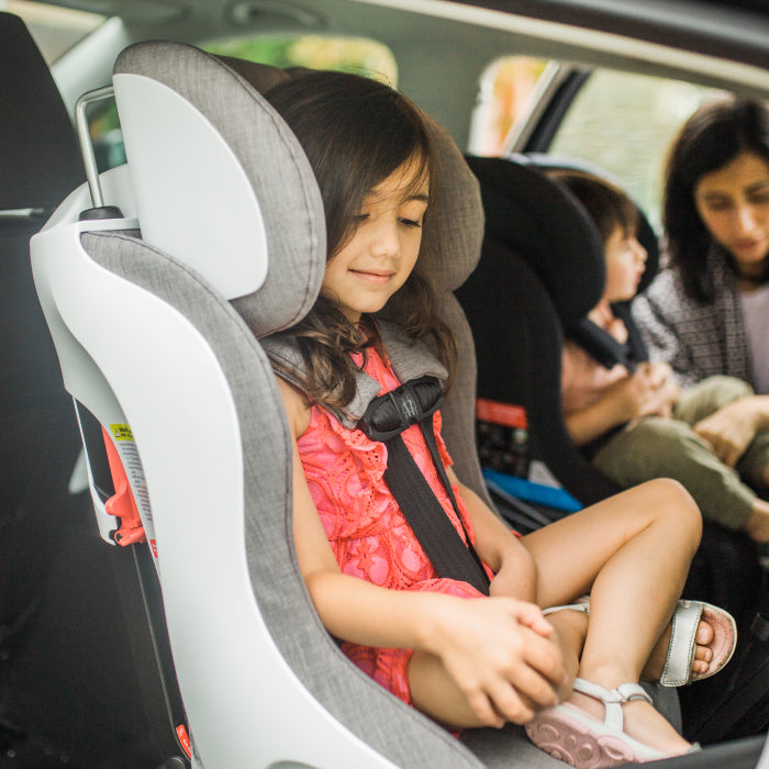 Child buckled into her Clek Foonf convertible car seat